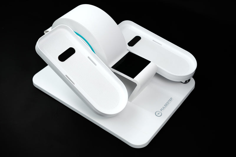 The PulseStep seated stepper: two white foot pedals on a flat base